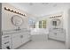Bright bathroom features double sinks, soaking tub, and updated fixtures at 1805 Abby Knoll Dr, Apex, NC 27502