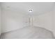 Well-lit bedroom has plush carpeting, double door closet, and neutral colored walls at 1805 Abby Knoll Dr, Apex, NC 27502