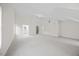 Spacious bonus room with neutral walls and plush carpeting throughout the space at 1805 Abby Knoll Dr, Apex, NC 27502