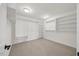 Walk-in closet provides ample space for storage with shelving and open hanging racks at 1805 Abby Knoll Dr, Apex, NC 27502