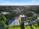 Aerial view of neighborhood amenities including a tennis court, pool, playground, and clubhouse at 1805 Abby Knoll Dr, Apex, NC 27502
