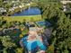 Aerial view of community pool and amenities, including a tennis court, playground, and clubhouse at 1805 Abby Knoll Dr, Apex, NC 27502