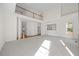 Open-concept living space featuring soaring ceilings, a second-story balcony, and natural light at 1805 Abby Knoll Dr, Apex, NC 27502