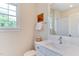 Bathroom featuring a granite sink and a mirror. Bathtub and natural light provided by a window at 1830 Wilshire Ave, Raleigh, NC 27608