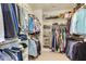 Spacious walk-in closet with ample hanging space, shelving, and shoe storage at 1830 Wilshire Ave, Raleigh, NC 27608