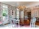 Bright dining room with large round table, stylish chairs, and decorative floral patterned curtains at 1830 Wilshire Ave, Raleigh, NC 27608