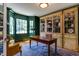 Classic office with custom built-ins, rich emerald walls, and a bay window nook at 1830 Wilshire Ave, Raleigh, NC 27608