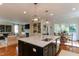 Kitchen with large center island that opens to living room and breakfast nook at 1830 Wilshire Ave, Raleigh, NC 27608