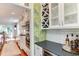 A kitchen with an adjacent wine bar at 1830 Wilshire Ave, Raleigh, NC 27608