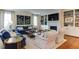 Comfortable living room featuring a fireplace, built-in shelving, and hardwood floors at 1830 Wilshire Ave, Raleigh, NC 27608