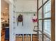 Mudroom features built-in storage, bench, cabinets, and decorative wallpaper adding a custom touch at 1830 Wilshire Ave, Raleigh, NC 27608
