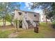 Backyard image showing the basement entrance with stairs leading up to the house at 203 Spring Street St, Louisburg, NC 27549