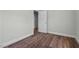 Featuring fresh paint, hard wood floors, base molding, and a door to the left, this room is full of potential at 203 Spring Street St, Louisburg, NC 27549