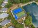 Aerial view of the community's tennis courts and lake at 208 Rockport Ridge Way, Cary, NC 27519