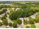 Aerial neighborhood view of tree-lined streets, well-maintained lawns and homes at 208 Rockport Ridge Way, Cary, NC 27519
