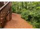 A view of the ground level of the backyard, trees are visible beyond at 208 Rockport Ridge Way, Cary, NC 27519