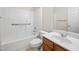 Bathroom with white tub/shower, a single sink, and a wood vanity at 208 Rockport Ridge Way, Cary, NC 27519