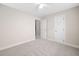 Bedroom with neutral carpet and a door to the hallway at 208 Rockport Ridge Way, Cary, NC 27519