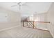 Bonus room with neutral carpet and white ceiling fan at 208 Rockport Ridge Way, Cary, NC 27519
