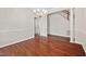 Dining room with hardwood floors, chandelier, and staircase in view at 208 Rockport Ridge Way, Cary, NC 27519