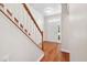 Inviting foyer with hardwood floors, staircase, and a bright entryway leading into the home at 208 Rockport Ridge Way, Cary, NC 27519