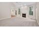 Spacious living room with a fireplace and large windows at 208 Rockport Ridge Way, Cary, NC 27519