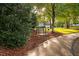 Picturesque walking path with a bench beside a green lawn at 208 Rockport Ridge Way, Cary, NC 27519