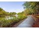 Picturesque walking path beside the tranquil lake at 208 Rockport Ridge Way, Cary, NC 27519