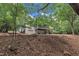 Back of house with a screened porch, walkout basement and yard at 2095 Woodberry Dr, Clayton, NC 27527