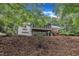 Back of house with a screened porch, walkout basement and yard at 2095 Woodberry Dr, Clayton, NC 27527