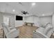Basement has a media center, theater-style seating and a modern ceiling fan at 2095 Woodberry Dr, Clayton, NC 27527