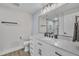 Bright bathroom featuring marble countertops, white cabinets, and modern fixtures at 2095 Woodberry Dr, Clayton, NC 27527
