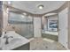 Spacious bathroom features tub, glass shower, updated fixtures and a view at 2095 Woodberry Dr, Clayton, NC 27527