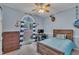 Nautical themed bedroom with hardwood furniture, carpet flooring, and decorations at 2095 Woodberry Dr, Clayton, NC 27527