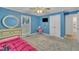 Bright blue bedroom with carpet flooring, dresser, and window at 2095 Woodberry Dr, Clayton, NC 27527