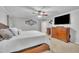 Bedroom featuring a large TV and a dresser, providing ample storage and entertainment at 2095 Woodberry Dr, Clayton, NC 27527