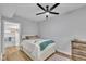 Cozy bedroom featuring a ceiling fan, walk-in closet, and wood floors at 2095 Woodberry Dr, Clayton, NC 27527
