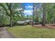 Charming home with a well-manicured lawn, and a private driveway surrounded by trees at 2095 Woodberry Dr, Clayton, NC 27527