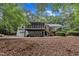 Side exterior view showing screen porch, walk out basement, and covered parking at 2095 Woodberry Dr, Clayton, NC 27527