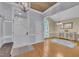 Inviting foyer with hardwood floors, a modern chandelier, and views into the dining area at 2095 Woodberry Dr, Clayton, NC 27527
