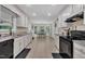 Bright and airy kitchen features granite countertops, stainless appliances, and views to the breakfast nook at 2095 Woodberry Dr, Clayton, NC 27527