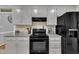 Well-equipped kitchen boasting modern appliances, granite countertops, and ample cabinet space at 2095 Woodberry Dr, Clayton, NC 27527