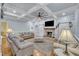 Cozy living room with a brick fireplace, coffered ceilings, and plush seating at 2095 Woodberry Dr, Clayton, NC 27527
