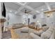 Cozy living room featuring beamed ceilings, hardwood floors, and a stone fireplace at 2095 Woodberry Dr, Clayton, NC 27527
