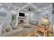 Charming living room with a stone fireplace, coffered ceilings, and access to the outdoors at 2095 Woodberry Dr, Clayton, NC 27527