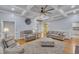 Bright living room featuring hardwood floors, coffered ceilings, and neutral furniture at 2095 Woodberry Dr, Clayton, NC 27527