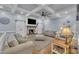 Stylish living room with a fireplace, beamed ceilings, and comfortable seating at 2095 Woodberry Dr, Clayton, NC 27527