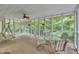 Relaxing screened porch with a table, chairs, and views of the backyard at 2095 Woodberry Dr, Clayton, NC 27527