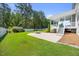 Spacious backyard featuring a fire pit, lush lawn, and shed at 2223 Copper Pond Way, Fuquay Varina, NC 27526