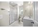 Bright bathroom featuring glass shower door, sink with faucet, toilet and clean white walls at 2223 Copper Pond Way, Fuquay Varina, NC 27526